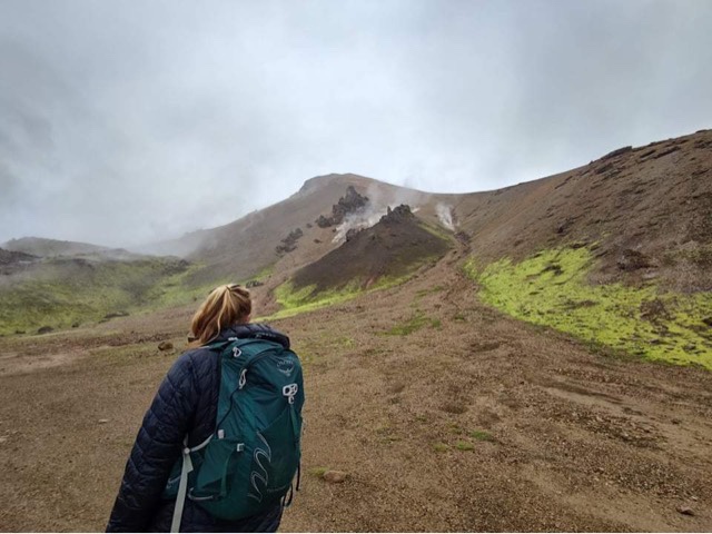 Women hiking with Osprey backpack in Landmannalaugar, Iceland.